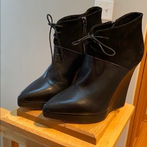 Reed Krakoff leather and suede wedge booties.